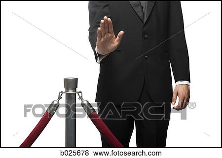 man in a tuxedo denying entry through a velvet rop View Large Photo Image Stock Photo - man in a tuxedo denying entry through a velvet rop. Fotosearch
