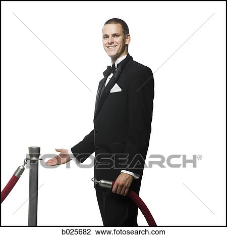 man in a tuxedo next to a velvet rope View Large Photo Image Stock Image - man in a tuxedo next to a velvet rope. Fotosearch