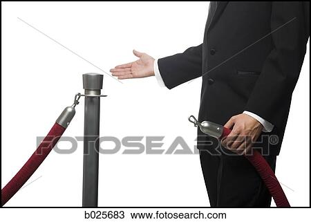 man in a tuxedo next to a velvet rope View Large Photo Image Stock Image - man in a tuxedo next to a velvet rope. Fotosearch