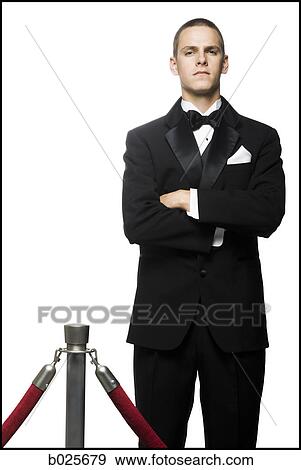 man in a tuxedo next to a velvet rope View Large Photo Image Stock Photo - man in a tuxedo next to a velvet rope. Fotosearch