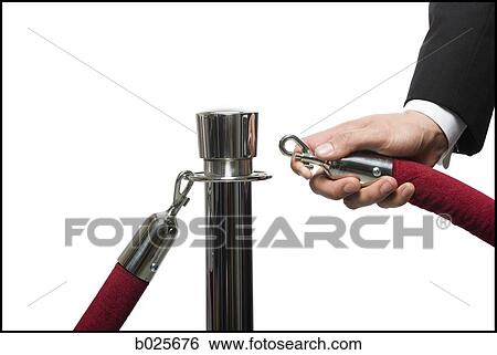 Stock Photograph - man in a tuxedo next to a velvet rope. Fotosearch