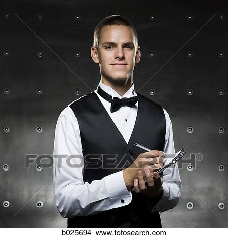 man in a tuxedo taking notes View Large Photo Image Picture - man in a tuxedo taking notes. Fotosearch