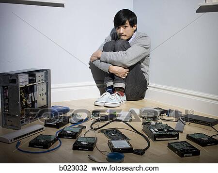 man in the corner surrounded by computer parts View Large Photo Image Stock Image - man in the corner surrounded by computer parts. Fotosearch