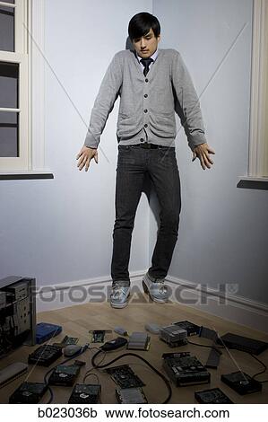 man in the corner surrounded by computer parts View Large Photo Image Stock Image - man in the corner surrounded by computer parts. Fotosearch
