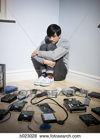 man in the corner surrounded by computer parts View Large Photo Image Stock Photo - man in the corner surrounded by computer parts. Fotosearch