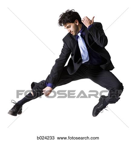 Stock Image - man jumping in the air. Fotosearch