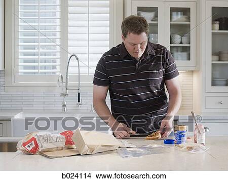 man making a school lunch View Large Photo Image Picture - man making a school lunch. Fotosearch
