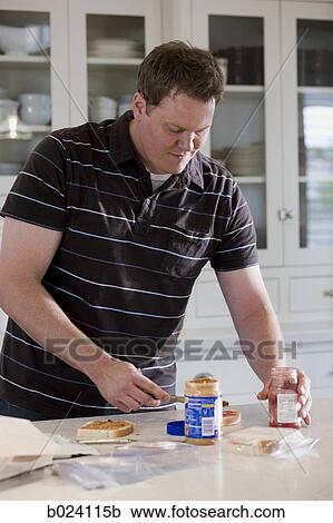 man making a school lunch View Large Photo Image Stock Image - man making a school lunch. Fotosearch