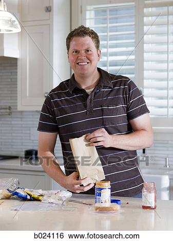man making a school lunch View Large Photo Image Stock Photograph - man making a school lunch. Fotosearch