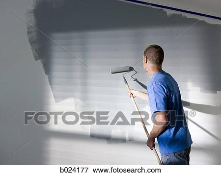 man painting a room View Large Photo Image Stock Photo - man painting a room. Fotosearch