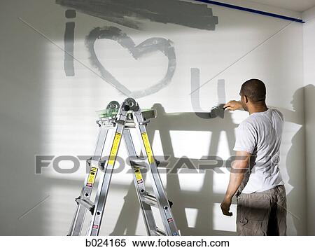 man painting a room View Large Photo Image Stock Photography - man painting a room. Fotosearch