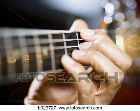 man playing a guitar View Large Photo Image Stock Photo - man playing a guitar. Fotosearch