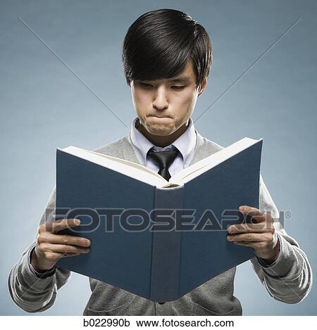 Stock Image - man reading a book. Fotosearch