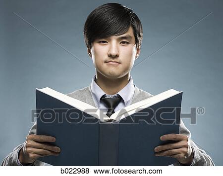 Stock Photo - man reading a book. Fotosearch