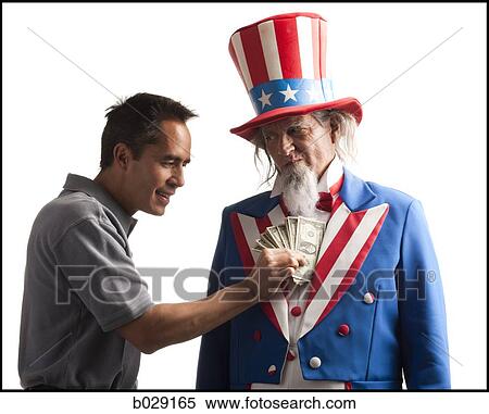 Stock Photography - man taking money out of uncle sam's coat. Fotosearch