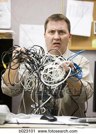 man trying to figure out computer wiring View Large Photo Image Stock Image - man trying to figure out computer wiring. Fotosearch
