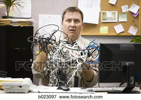 man trying to figure out computer wiring View Large Photo Image Stock Photo - man trying to figure out computer wiring. Fotosearch