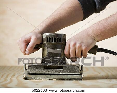 man using a power sander View Large Photo Image Stock Image - man using a power sander. Fotosearch