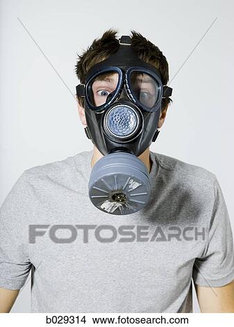 Picture - man wearing a gas mask. Fotosearch