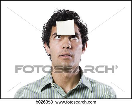 man with a post it note on his forehead View Large Photo Image Stock Photo - man with a post it note on his forehead. Fotosearch
