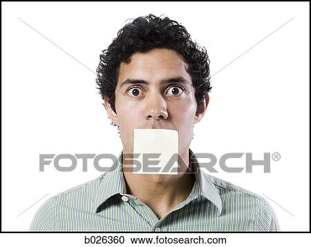 Stock Image - man with a post it note over his mouth. Fotosearch
