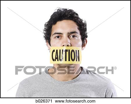 man with caution tape over his mouth View Large Photo Image Stock Image - man with caution tape over his mouth. Fotosearch