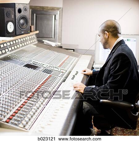 man working in a recording studio View Large Photo Image Stock Image - man working in a recording studio. Fotosearch
