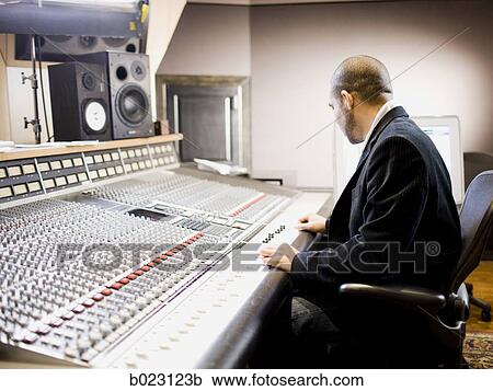 man working in a recording studio View Large Photo Image Stock Image - man working in a recording studio. Fotosearch