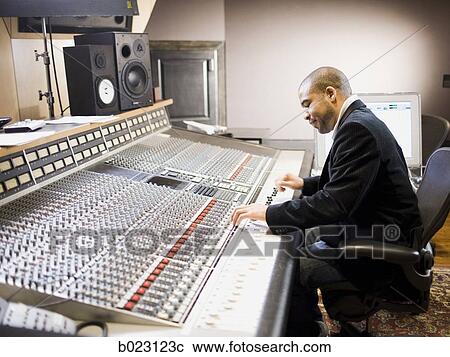 man working in a recording studio View Large Photo Image Stock Image - man working in a recording studio. Fotosearch