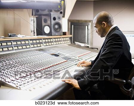 man working in a recording studio View Large Photo Image Stock Image - man working in a recording studio. Fotosearch