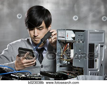 man working on a computer View Large Photo Image Stock Image - man working on a computer. Fotosearch