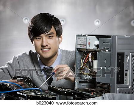 man working on a computer View Large Photo Image Stock Image - man working on a computer. Fotosearch
