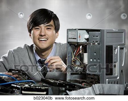 man working on a computer View Large Photo Image Stock Image - man working on a computer. Fotosearch