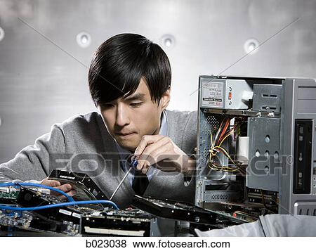 man working on a computer View Large Photo Image Stock Photo - man working on a computer. Fotosearch
