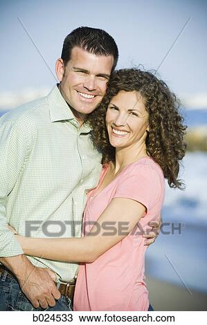 mid adult couple at the beach View Large Photo Image Stock Image - mid adult couple at the beach. Fotosearch