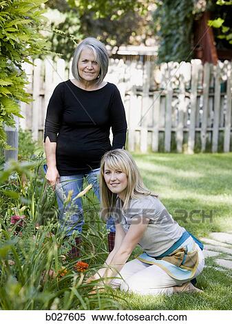 mother and adult daughter in the garden together View Large Photo Image Stock Photography - mother and adult daughter in the garden together. Fotosearch