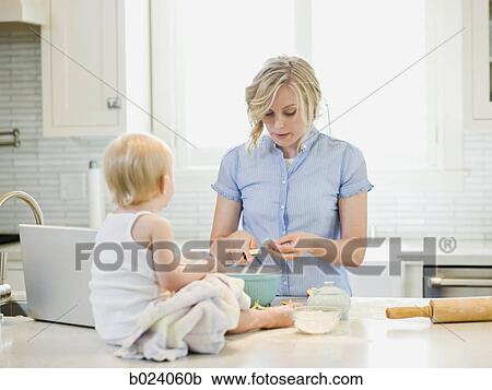 mother and baby girl cooking in the kitchen View Large Photo Image Stock Image - mother and baby girl cooking in the kitchen. Fotosearch