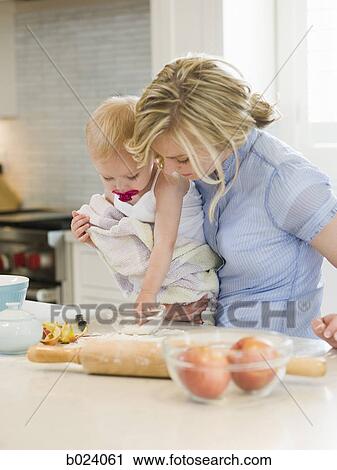 mother and baby girl cooking in the kitchen View Large Photo Image Stock Image - mother and baby girl cooking in the kitchen. Fotosearch