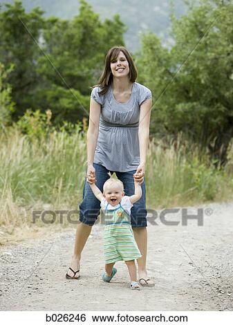 mother and baby girl learning to walk View Large Photo Image Stock Photograph - mother and baby girl learning to walk. Fotosearch