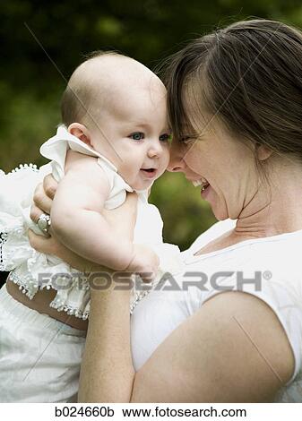 Stock Image - mother and baby girl. Fotosearch