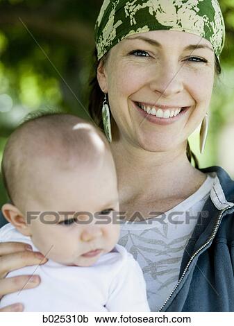 Stock Image - mother and baby girl. Fotosearch