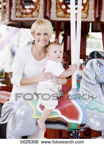 mother and baby on a merry-go-round View Large Photo Image Stock Photo - mother and baby on a merry-go-round. Fotosearch