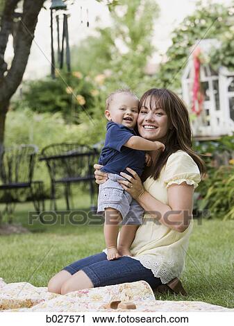 mother and baby son in the garden View Large Photo Image Stock Image - mother and baby son in the garden. Fotosearch