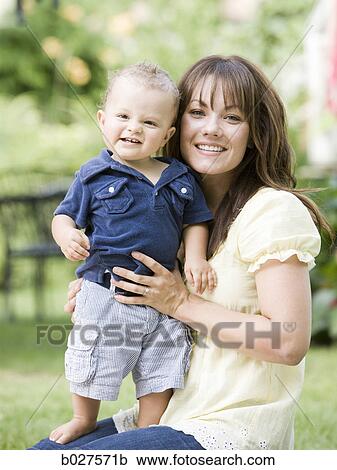 mother and baby son in the garden View Large Photo Image Stock Image - mother and baby son in the garden. Fotosearch