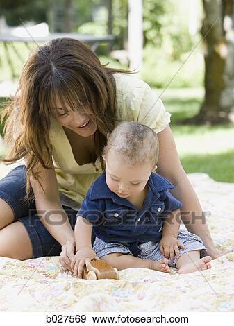 mother and baby son in the garden View Large Photo Image Stock Photo - mother and baby son in the garden. Fotosearch