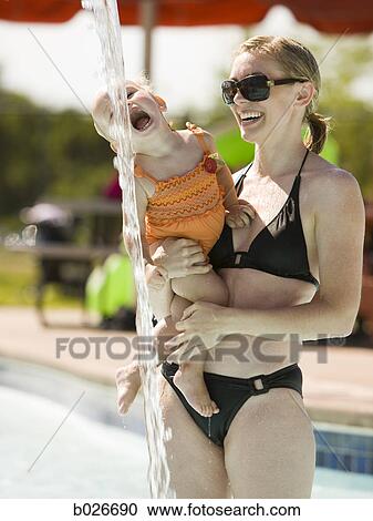 mother and daughter at a waterpark View Large Photo Image Stock Image - mother and daughter at a waterpark. Fotosearch