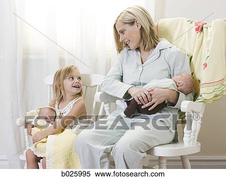 mother and daughter each holding a newborn baby View Large Photo Image Stock Photography - mother and daughter each holding a newborn baby. Fotosearch