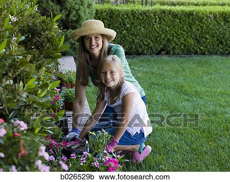 mother and daughter in the garden View Large Photo Image Stock Image - mother and daughter in the garden. Fotosearch