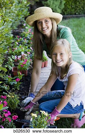 mother and daughter in the garden View Large Photo Image Stock Image - mother and daughter in the garden. Fotosearch
