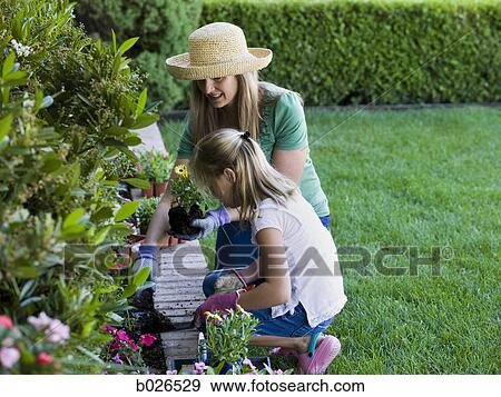 mother and daughter in the garden View Large Photo Image Stock Photo - mother and daughter in the garden. Fotosearch